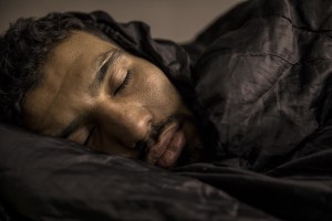 A migrant sleeps inside a reception center in Velika Kladusa, Bosnia and Herzegovina on November 30, 2018.