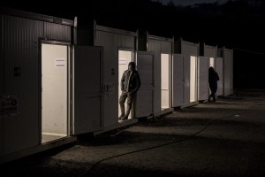 Migrants are seen outside an abandoned building in the outskirts of the Bosnian city of Bihać, Bosnia and Herzegovina on December 2, 2018.
