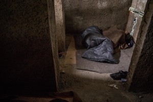 A migrant sleeps inside an abandoned building in the outskirts of the Bosnian city of Bihać, Bosnia and Herzegovina on December 1, 2018.