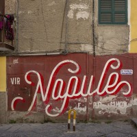 A mural with the famous slogan “Vir Napule e po muor” (see Naples and then die) realized by the French brothers Toqué is seen in a street of Sanità district, in Naples, Italy on April 9, 2019.