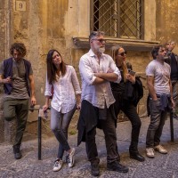 Tourists during the street art tour organized by the cultural association “400 ml” in Naples, Italy on March 24, 2019. Napoli Paint Stories street art and graffiti tour is a touristic walk in the neapolitan historical center through murales,stencils,slogans,posters and graffiti to discover urban art.