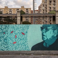 A mural depicting Danilo Dolci, who was an Italian sociologist, poet, educator and activist of non-violence, in Scampia district, Naples, Italy on March 9, 2019. The mural is located near the ”garden of non-violence and the five continents” and is part of a project realized by “Raro” and Fabio della Ratta “biodpi”,  with the collaboration of three boys from Gambia.