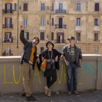 Tourists during the street art tour organized by the cultural association “400 ml” in Naples, Italy on March 24, 2019. Napoli Paint Stories streetart and graffiti tour is a touristic walk in the neapolitan historical center through murales, stencils, slogans, posters and graffiti to discover urban art.