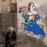 A portrait of the Neapolitan artist “Roxy in the box” near a work realized by her depicting the American soprano Maria Callas in Naples, in Italy on March 22, 2019.