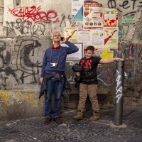 Tourists during a street art tour organized by the cultural association “400 ml” in Naples, Italy on March 24, 2019. Napoli Paint Stories streetart and graffiti tour is a touristic walk in the neapolitan historical center through murales, stencils, slogans, 
posters and graffiti to discover urban art.