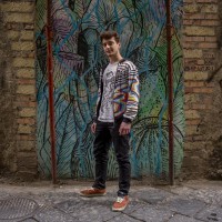 Matteo, 22 years old is portrayd in the alleys of the historical center of Naples, in Italy on April 10, 2019. He thinks that street art is positive except in the case where  monuments are damaged.