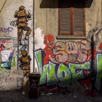 A mural of the Italian street artist and photographer Eduardo Castaldo in the alleys of the historical center of Naples, Italy on March 24, 2019.