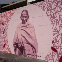 A mural depicting Mahatma Gandhi, who was an Indian politician, philosopher and lawyer, in Scampia district, Naples, Italy on April 9, 2019. The mural is located near the ”garden of non-violence and the five continents” and is part of a project realized by “Raro” and Fabio della Ratta “biodpi”,  with the collaboration of three boys from Gambia.