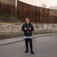 Tommaso is portrayed near the ”garden of non-violence and the five continents” in Scampia district, Naples, Italy on March 9, 2019. Tommaso hopes that the new murals realized in Scampia will not be ruined by dull acts of vandalism.