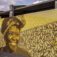 A mural depicting Wangari Muta Maathai, who was a Kenyan environmentalist, political activist and biologist in Scampia district, Naples, Italy on March 9, 2019. The mural is located near the ”garden of non-violence and the five continents” and is part of a project realized by “Raro” and Fabio della Ratta “biodpi”,  with the collaboration of three boys from Gambia.