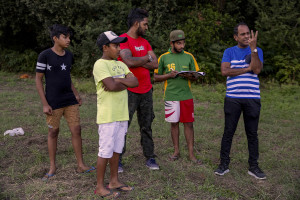 A player notes the scores during a match of “elle” in Naples, Italy on September 29, 2019. Every Sunday hundreds of people belonging to the Sri Lankan community in Italy gather in the “Real Bosco di Capodimonte” of Naples and play “elle”, a very popular Sri Lankan bat-and-ball game, often played in rural villages and urban areas.