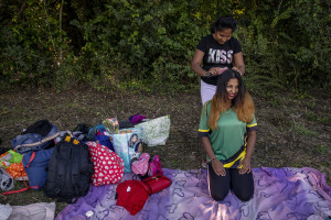 Players are seen before a match of “elle” in Naples, Italy on September 29, 2019. Every Sunday hundreds of people belonging to the Sri Lankan community in Italy gather in the “Real Bosco di Capodimonte” of Naples and play “elle”, a very popular Sri Lankan bat-and-ball game, often played in rural villages and urban areas.