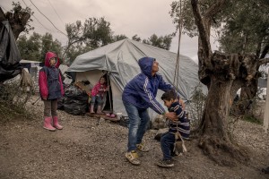 Children play with a swing inside the Moria refugee camp on the island of Lesbos in Greece on February 20, 2020. About 20000 migrants and asylum seekers – mostly coming from Afghanistan and Syria – live in the official Moria camp and in the olive grove that is located nearby.