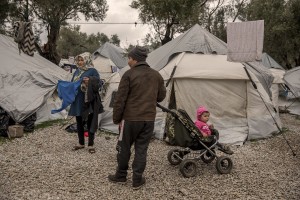 People from Afghanistan are seen inside the Moria refugee camp on the island of Lesbos in Greece on February 20, 2020. About 20000 migrants and asylum seekers – mostly coming from Afghanistan and Syria – live in the official Moria camp and in the olive grove that is located nearby.