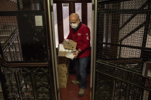 Patrizio, 53 years old and volunteer of the Italian Red Cross for about 1 years distributes food and medicines to a retirement home for the elderly, during coronavirus emergency in Naples, Italy on April 2, 2020.