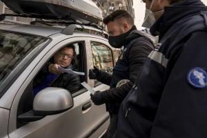 Local police officers are seen during security checks on the eighth day of unprecedented lockdown across of all Italy imposed to slow the spread of coronavirus in Naples, Southern Italy on March 17, 2020. Despite government bans, many people continue to go down the street, on foot or by car, for no important reason.