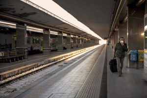 A man wearing a mask is seen inside the central station on the second day of unprecedented lockdown across of all Italy imposed to slow the spread of coronavirus in Naples, Southern Italy on March 11, 2020.