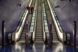 People wearing masks on the escalators of the Toledo metro station on the fifth day of unprecedented lockdown across of all Italy imposed to slow the spread of coronavirus in Naples, Southern Italy on March 14, 2020.