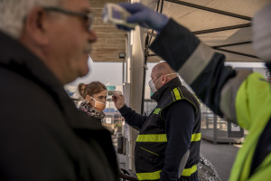Medical officers check the temperature of people traveling to the islands of Ischia, Capri and Procida, in the port of Naples, Italy on March 11, 2020. In the evening of March 9, 2020 Prime Minister Giuseppe Conte has officially declared that the entire Italian peninsula will be considered “red zone” due to the fast spread of the coronavirus.