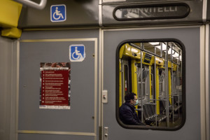 A man wearing a mask is seen inside a metropolitan train on the fifth day of unprecedented lockdown across of all Italy imposed to slow the spread of coronavirus in Naples, Southern Italy on March 14, 2020.