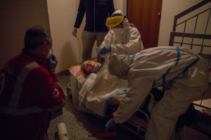 Maria, 87 years old and suspected covid-19 positive has a respiratory crisis before being transferred to the hospital after an emergency call to the Italian Red Cross for experiencing respiratory problems in Villa di Serio, province of Bergamo, Northern Italy on April 12, 2020.