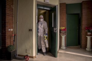 A nurses of the Italian Red Cross is seen before an intervention at a person’s home suspected to have coronavirus symptoms in Villa di Serio, province of Bergamo, Northern Italy on April 18, 2020.