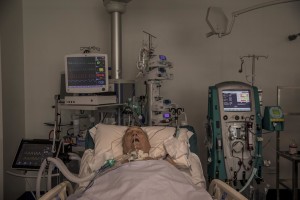 A patient lies in bed inside the coronavirus intensive care unit of the “Poliambulanza Foundation” hospital in Brescia, Italy on April 9, 2020. “Poliambulanza Foundation” is a non-profit multispecialist private hospital, affiliated with the National Health Service.