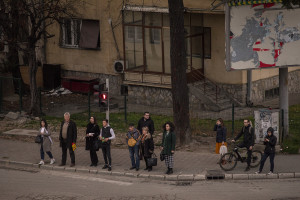 People wait at the traffic lights to be able to cross the street in Skopje, North Macedonia on March 3, 2020. According to the World Health Organization (WHO), 2,574 people die prematurely every year in Macedonia as a result of air pollution. Poor air quality in the Republic of Macedonia is mainly due to the tiny combustion particles called PM10 (10 micrometers or less in diameter) and PM2.5 (2.5 micrometers or less in diameter). These can easily penetrate deeply into the body, causing dangerous health problems and then death.