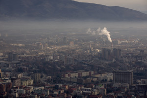 A picture taken from Vodno mountain shows a cloud of pollution over the city of Skopje, North 
Macedonia on February 28, 2020. Skopje, located in the center of the Balkan peninsula, is nestled in a valley between mountain ranges that hem the city. The pollution problem is complicated by the inversion of temperature, a natural phenomenon that causes warm air to remain above cold air. This phenomenon creates a blanket of smog that settles heavily over the valley, trapping polluted air on city streets and in the lungs of residents. Sometimes during the winter season the airport is closed due to the presence of toxic fog.