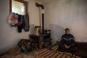 Fadil, 45 years old is portrayed inside his house in the area of Shutka in Skopje, North Macedonia on February 29, 2020. During the winter Fadil, like many others households, burns coal, scrap wood, textiles or trash in order to keep warm. This obsolete heating system is one of the biggest contributors to air pollution in the country. Although the electricity tariffs in Macedonia are among the lowest in Europe, energy can cost a third or even half of a citizen’s  average monthly salary. This is the reason why many residents burn wood to heat their home, often buying it on the black market where it costs less, but is more toxic to the environment.