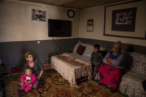 Selma, 18 years old and her family are seen inside their house in the area of Shutka in Skopje, North Macedonia on February 29, 2020. During the winter Selma, like many others households, burns coal, scrap wood, textiles or trash in order to keep warm. This obsolete heating system is one of the biggest contributors to air pollution in the country. Although the electricity tariffs in Macedonia are among the lowest in Europe, energy can cost a third or even half of a citizen’s  average monthly salary. This is the reason why many residents burn wood to heat their home, often buying it on the black market where it costs less, but is more toxic to the environment.