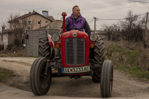 A farmer is portrayed aboard his tractor near “Usje” cement factory in Skopje, North Macedonia on March 3, 2020. According to green activists “Usje” cement factory uses waste as fuel during its production cycle. One of the main causes of air pollution in Skopje are the industries, in general older than in the rest of Europe. As reported on the website republika.mk the company confirmed that it is using petroleum coke and former employees have recently claimed that it was also burning old car tires brought in from Greece. The area around “Usje” cement factory has some of the worst levels of air pollution in Skopje.