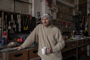 Andrej, 43 years old is portrayed insde the laboratory where he has been working as a sculptor for 6 months in Skopje, North Macedonia on March 4, 2020. Andrej is very concerned about his health and the environmental situation in Macedonia. Its neighbors, like many others households, burns coal, scrap wood, textiles or trash in order to keep warm. This obsolete heating system is one of the biggest contributors to air pollution in the country. Although the electricity tariffs in Macedonia are among the lowest in Europe, energy can cost a third or even half of a citizen’s  average monthly salary. This is the reason why many residents burn wood to heat their home, often buying it on the black market where it costs less, but is more toxic to the environment.