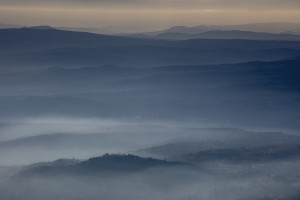 A picture taken from Vodno mountain shows a cloud of pollution over the city of Skopje, North Macedonia on February 28, 2020. Skopje, located in the center of the Balkan peninsula, is nestled in a valley between mountain ranges that hem the city. The pollution problem is complicated by the inversion of temperature, a natural phenomenon that causes warm air to remain above cold air. This phenomenon creates a blanket of smog that settles heavily over the valley, trapping polluted air on city streets and in the lungs of residents. During the winter season the airport is sometimes closed due to the presence of toxic fog.