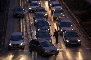 A man asks for alms among the cars stuck in traffic in Skopje, North Macedonia on March 3, 2020. Traffic also contributes to air pollution, but the lack of an official census since 2002, however, makes hard to quantify the problem.