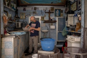 Vincenzo, 64 years old is seen at work inside his fish shop in the “Rione Sanità” in Naples, Italy on June 17, 2020. Popular neighborhoods are those that more than others are suffering from the economic crisis generated by the coronavirus. The rate of poverty and unemployment that was higher than the national average in Southern Italy even before the pandemic, increased following the lockdown imposed by the government to counter the spread of the coronavirus, which blocked the country’s economy for more than two months.