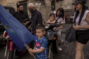 People are seen in the “Rione Sanità” in Naples, Italy on June 17, 2020. Popular neighborhoods are those that more than others are suffering from the economic crisis generated by the coronavirus. The rate of poverty and unemployment that was higher than the national average in Southern Italy even before the pandemic, increased following the lockdown imposed by the government to counter the spread of the coronavirus, which blocked the country’s economy for more than two months.