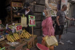 Ciro Romeo, 37 years old is seen at work inside his fruit and vegetable shop in the “Rione Sanità” in Naples, Italy on June 17, 2020. Popular neighborhoods are those that more than others are suffering from the economic crisis generated by the coronavirus. The rate of poverty and unemployment that was higher than the national average in Southern Italy even before the pandemic, increased following the lockdown imposed by the government to counter the spread of the coronavirus, which blocked the country’s economy for more than two months.