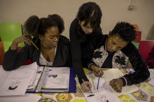 Nigerian girls take Italian language lessons in the house where they are hosted by the Piam non-profit organization in Asti, Northern Italy on January 14, 2020.