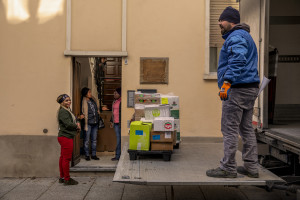 A bellhop delivers food to the headquarters of the Piam non-profit organization in Asti, Northern Italy on January 9, 2020.