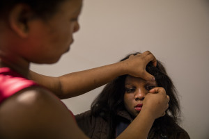 Girls wear makeup before the Sunday mass in Asti, Northern Italy on January 12, 2020.