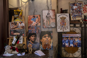 Pictures depicting the Argentine soccer legend Diego Armando Maradona are seen outisde a restaurant in the Spanish Quarter in Naples, Southern Italy on November 24, 2021. Diego Armando Maradona died on November 25 of last year and next November 25, 2021 will be the anniversary of his death.