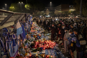 People are seen outside San Paolo stadium after the announcement of the Argentine soccer legend Diego Armando Maradona death in Naples, Italy on November 26, 2020.