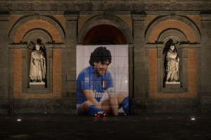 A big picture of the Argentine soccer legend Diego Armando Maradona is seen on the main facade of the Royal Palace after the announcement of his death in Naples, Italy on November 26, 2020.