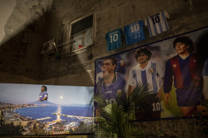 Pictures and football shirts of the Argentine soccer legend Diego Armando Maradona are seen in the Spanish Quarter after the announcement of his death, in Naples, Italy on November 27, 2020.