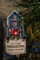 An altar dedicated to the Argentine soccer legend Diego Armando Maradona is seen in the Spanish Quarter after the announcement of his death, in Naples, Italy on November 27, 2020.
