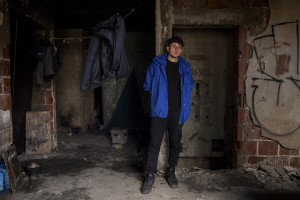 A migrant is seen inside an abandoned building in Bihac, Bosnia and Herzegovina on January 22, 2021. Lots of migrants avoid staying inside the Bosnian official refugee camps because of the hard conditions in which they are forced to live and also because the people hosted in the official camps  cannot go out freely.