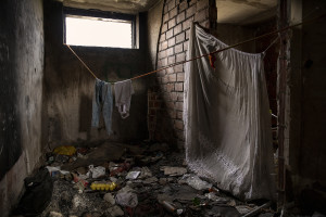 Clothes hanging out to dry inside an abandoned building in Bihac, Bosnia and Herzegovina on January 22, 2021. Lots of migrants avoid staying inside the Bosnian official refugee camps because of the hard conditions in which they are forced to live and also because the people hosted in the official camps  cannot go out freely.