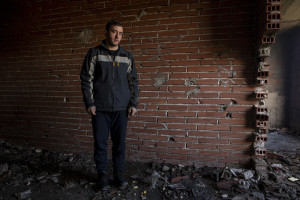 Nekib, 16 years old from Afghanistan is portrayed inside an abandoned building in Bihac, Bosnia and Herzegovina on January 22, 2021. Lots of migrants avoid staying inside the Bosnian official refugee camps because of the hard conditions in which they are forced to live and also because the people hosted in the official camps  cannot go out freely.