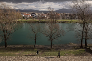 Migrants are seen outside an abandoned building in Bihac, Bosnia and Herzegovina on January 22, 2021. Lots of migrants avoid staying inside the Bosnian official refugee camps because of the hard conditions in which they are forced to live and also because the people hosted in the official camps  cannot go out freely.